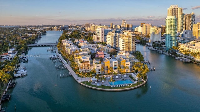 aerial view at dusk with a water view