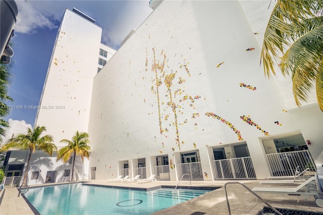 view of pool featuring a patio