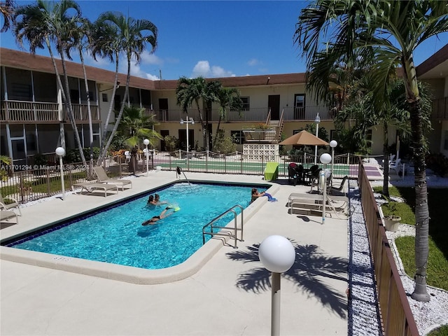 view of swimming pool featuring a patio area