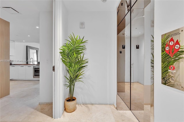 15701 Collins Ave Unit 703, Sunny Isles Beach, FL 33160 - corridor featuring wine cooler and recessed lighting
