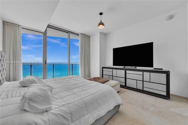 bedroom featuring expansive windows