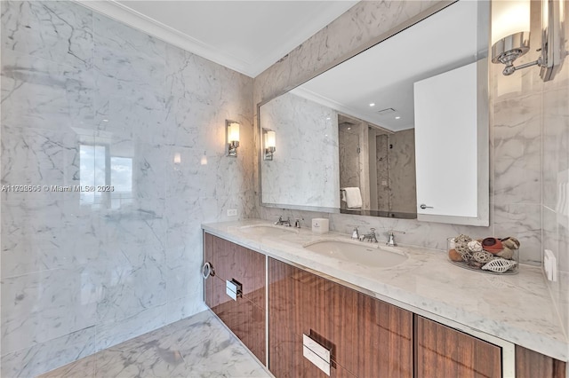 bathroom with vanity, ornamental molding, and tile walls