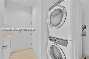 15701 Collins Ave Unit 703, Sunny Isles Beach, FL 33160 - washroom featuring stacked washer and clothes dryer