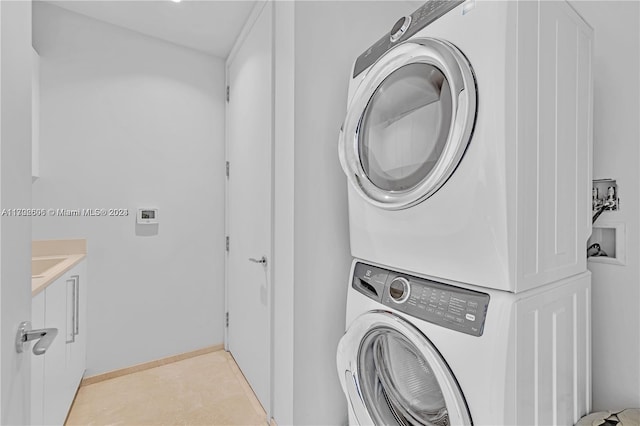 washroom with stacked washer and clothes dryer