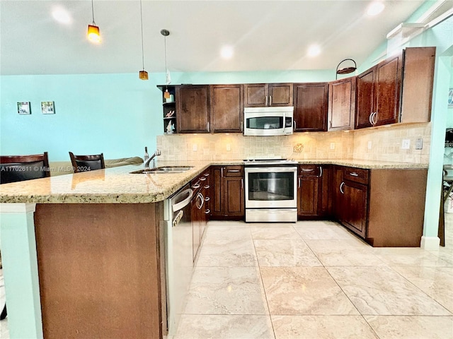 kitchen with sink, hanging light fixtures, tasteful backsplash, kitchen peninsula, and stainless steel appliances