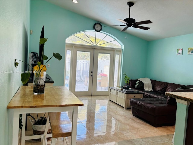 living room with ceiling fan, french doors, and lofted ceiling