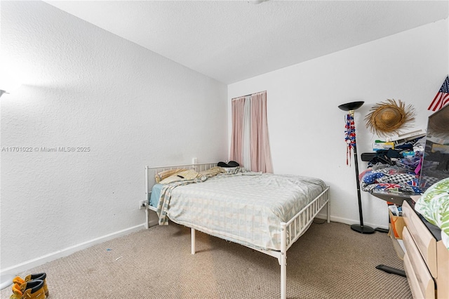 bedroom with lofted ceiling and carpet floors