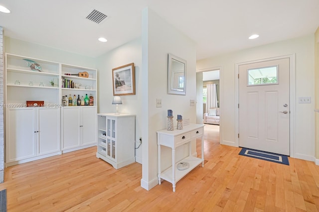 entryway with light hardwood / wood-style floors