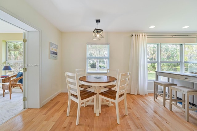 dining area featuring light wood-type flooring