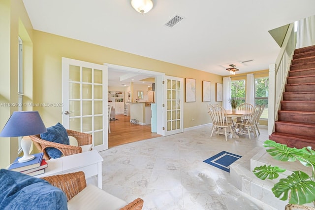 671 Live Oak Ln, La Belle, FL 33935 - living area featuring stairway, baseboards, french doors, and visible vents