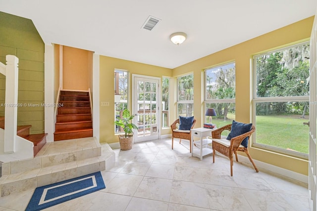 sunroom / solarium featuring plenty of natural light