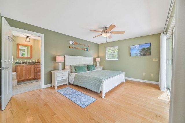 bedroom featuring connected bathroom, ceiling fan, and light hardwood / wood-style flooring