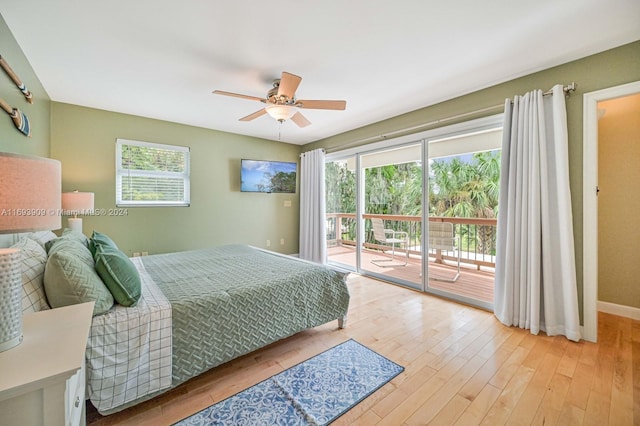 bedroom with ceiling fan, access to exterior, light hardwood / wood-style flooring, and multiple windows