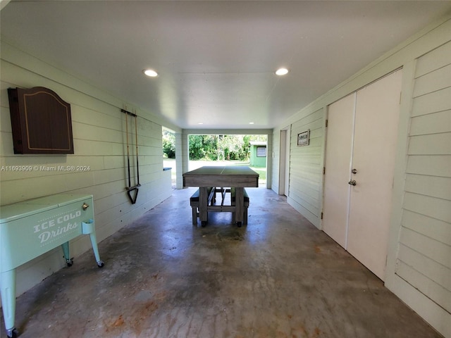 interior space featuring wooden walls