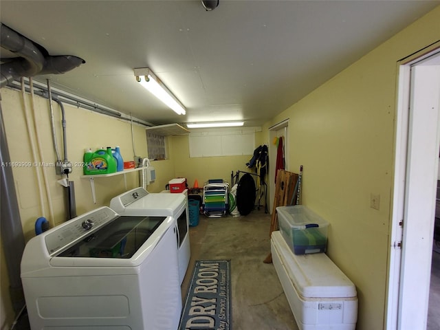 clothes washing area featuring washer and clothes dryer