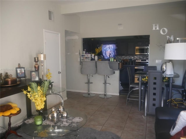 living room with dark tile patterned floors