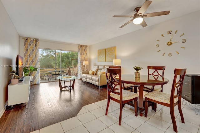 dining room with hardwood / wood-style floors and ceiling fan