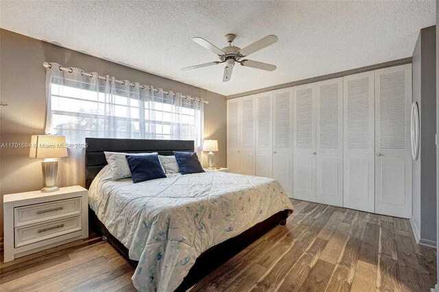 4451 NW 16th St Unit K204, Lauderhill, FL 33313 - bedroom featuring wood finished floors, a textured ceiling, and ceiling fan
