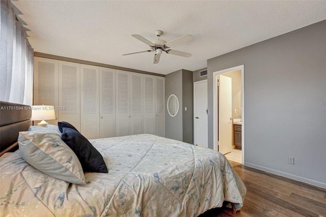 bedroom with ensuite bathroom, hardwood / wood-style flooring, ceiling fan, a textured ceiling, and a closet