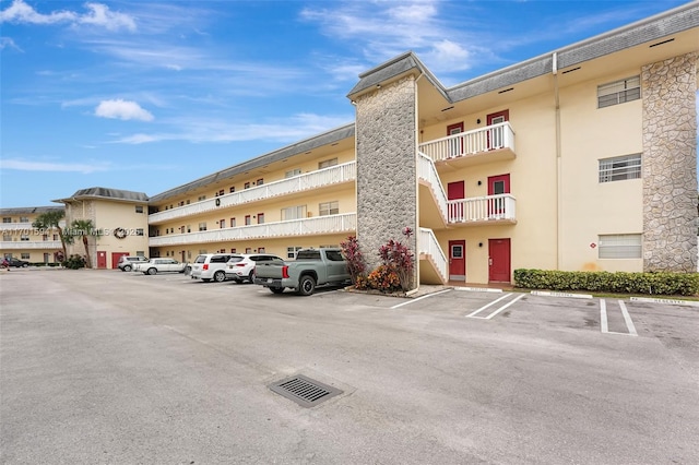 4451 NW 16th St Unit K204, Lauderhill, FL 33313 - view of building exterior with uncovered parking
