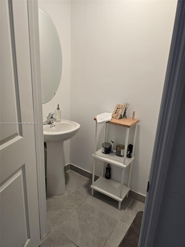 bathroom with tile patterned flooring and sink