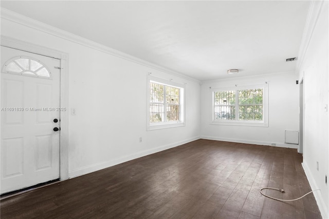 foyer featuring visible vents, plenty of natural light, dark wood-style floors, and crown molding