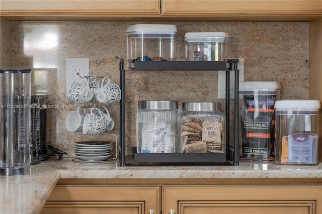 room details with light brown cabinets and light stone counters