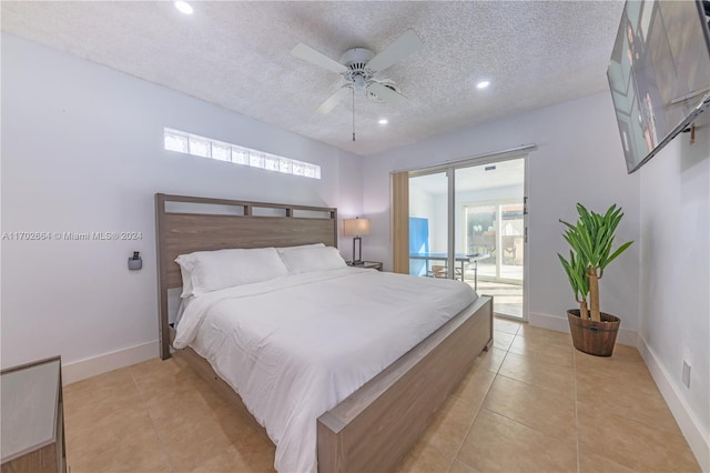 bedroom with access to exterior, light tile patterned floors, a textured ceiling, and ceiling fan