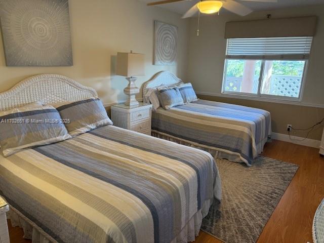 bedroom featuring hardwood / wood-style flooring and ceiling fan