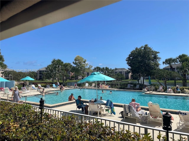 view of swimming pool featuring a patio area