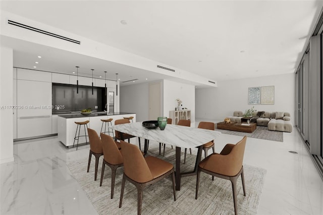 dining room with marble finish floor, visible vents, and recessed lighting