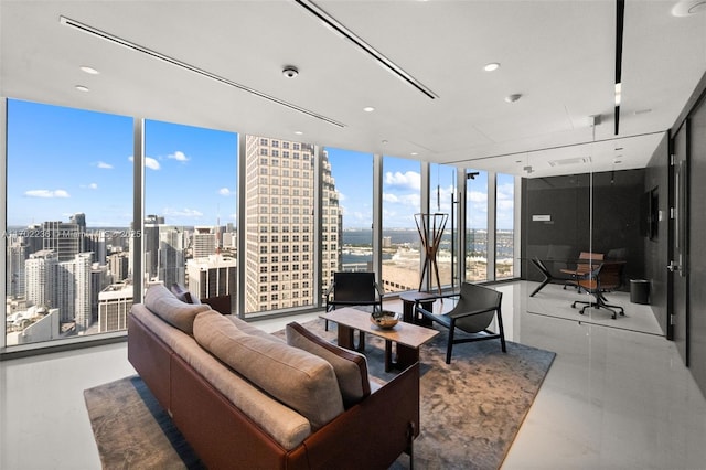 living room with a wall of windows and a city view