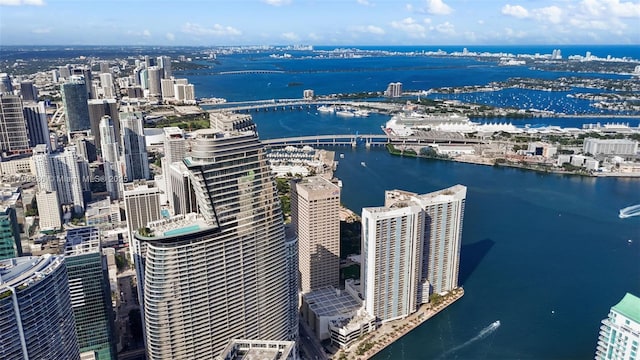 birds eye view of property featuring a city view and a water view