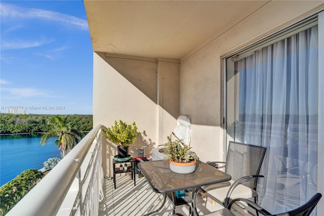 balcony featuring a water view