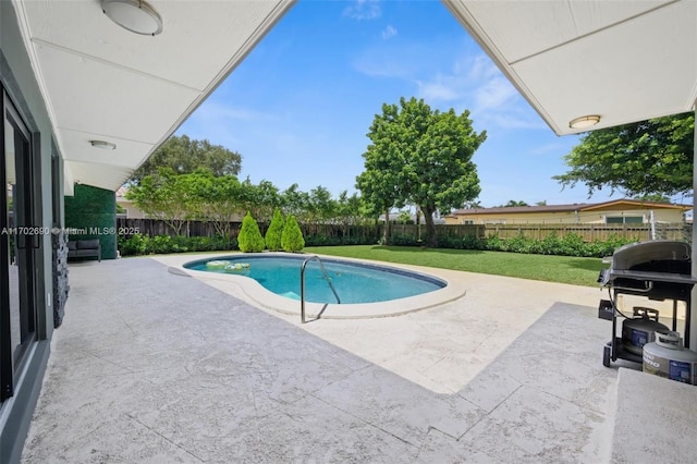 view of pool featuring a lawn, area for grilling, and a patio