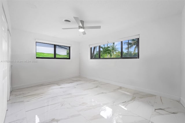 unfurnished room with ceiling fan