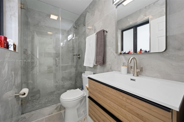 bathroom featuring walk in shower, vanity, and toilet