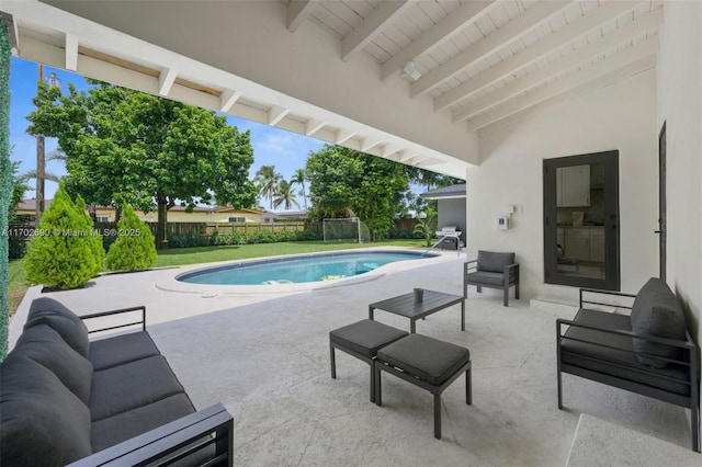 view of swimming pool with an outdoor living space and a patio