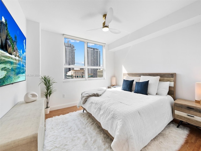 bedroom featuring ceiling fan and wood-type flooring