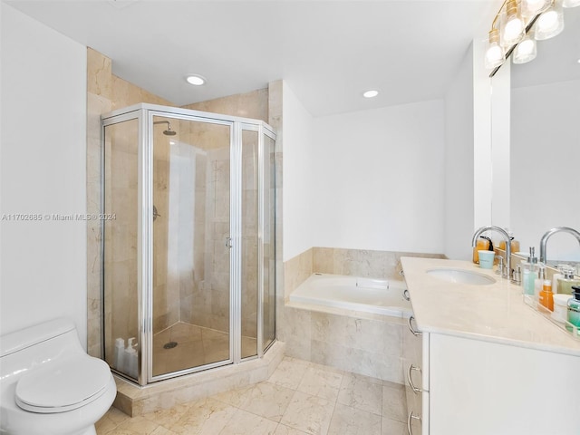 full bathroom featuring vanity, shower with separate bathtub, and toilet