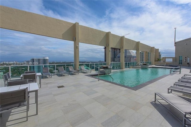 view of pool featuring a patio