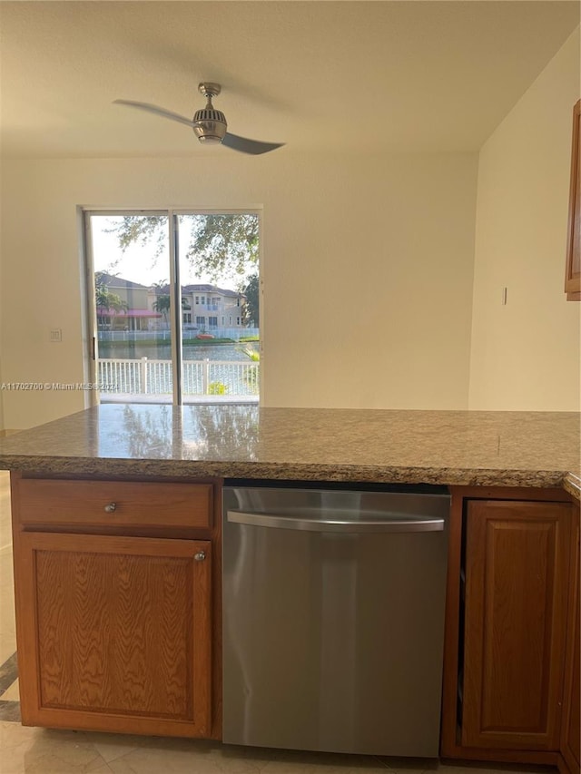 kitchen with ceiling fan, dishwasher, and a water view