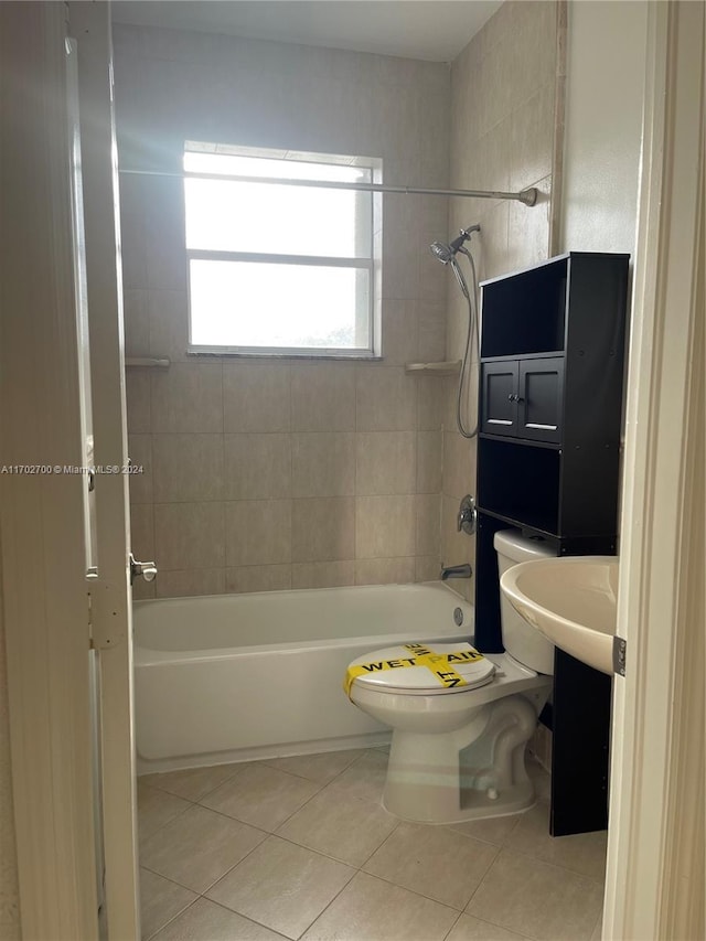 full bathroom featuring tile patterned flooring, vanity, toilet, and tiled shower / bath