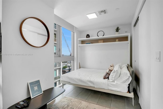 bedroom featuring tile patterned flooring