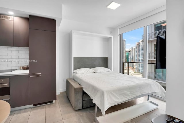 bedroom featuring light tile patterned floors