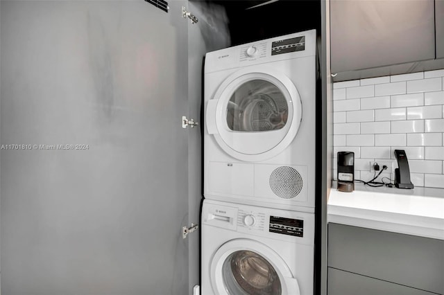 laundry room featuring stacked washer and dryer