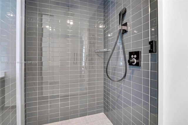 bathroom with a tile shower