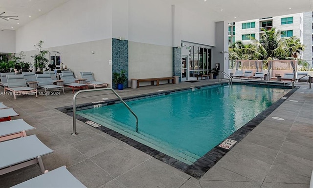 view of pool featuring ceiling fan