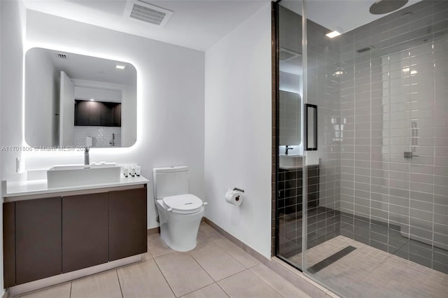 bathroom featuring tile patterned flooring, vanity, an enclosed shower, and toilet