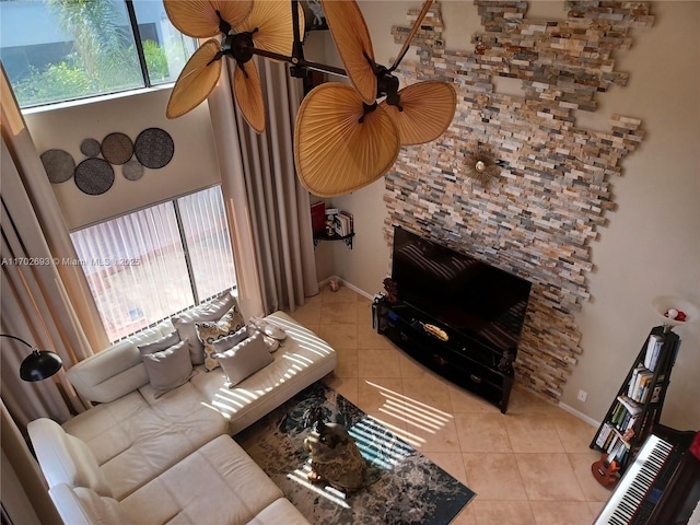 living room featuring a fireplace and light tile patterned floors